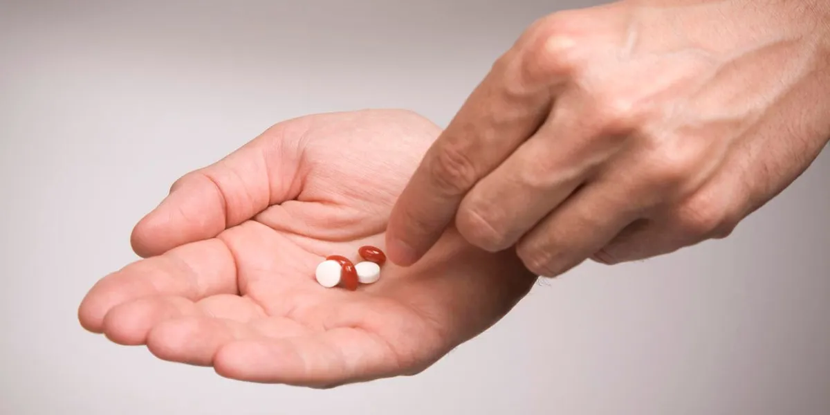 giving pills to patient photo with clipping path