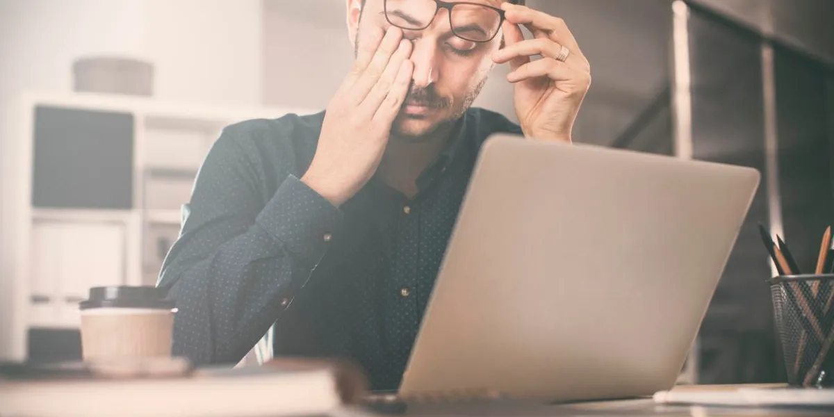 tired young business man in office