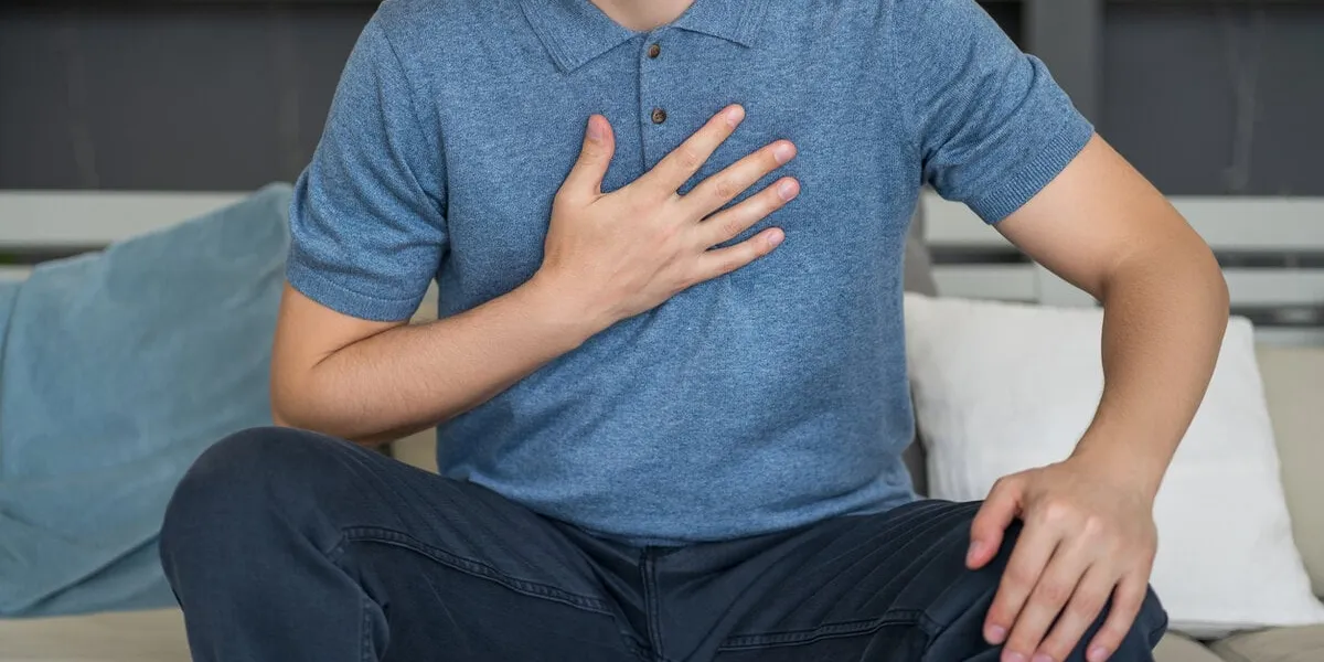 chest pain and cough, man with lung ache at home, health problems concept