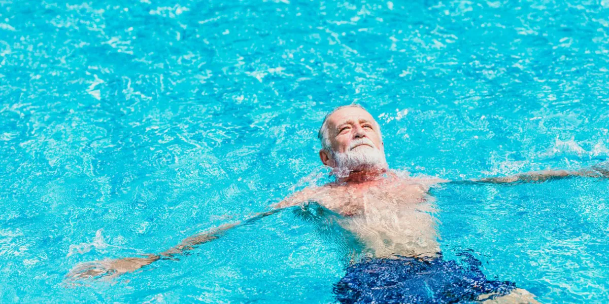 healthy elder enjoy relax swimming in the pool alone vacation holiday