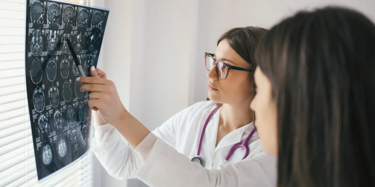 female doctor explaining x-ray results to patient