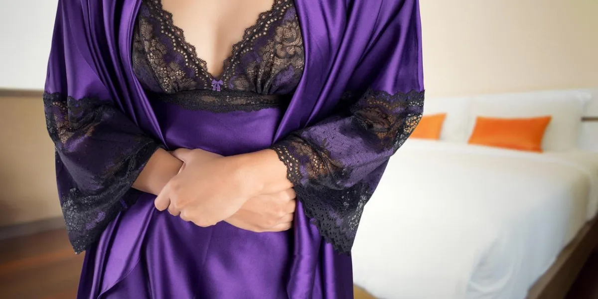 the woman in purple satin nightgown wake up for go to restroom people with diarrhea problem concept