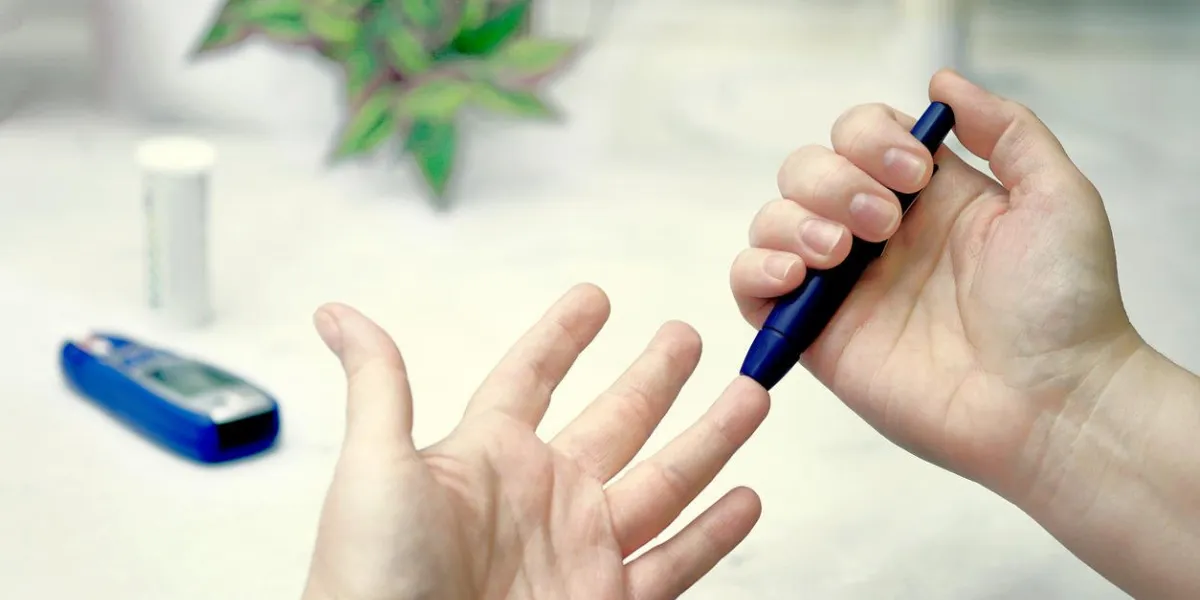 a medical test, checking a drop of blood on the sugar level pierce the finger with a lancet