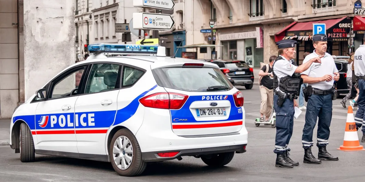 30 july 2019, paris, france  a police car and officers stand near, during the closure of streets during a city event