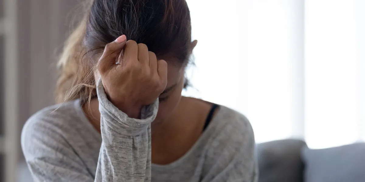 depressed upset young woman feeling hurt sad stressed troubled with unwanted pregnancy, regret mistake abortion, having headache or drug addiction, suffer from grief dramatic bad problem concept