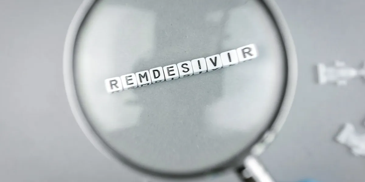 sars cov 2 covid 19 magnifying glass on alphabet dices with the word remdesivir a possible treatment for corona virus