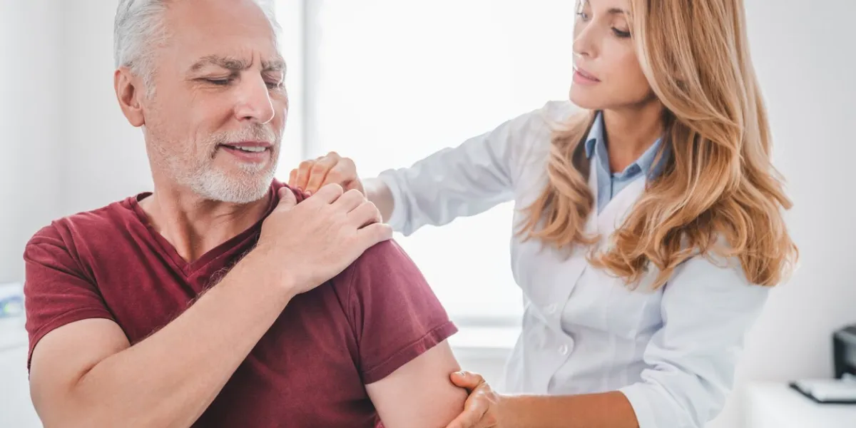 traumatology, orthopedist concept medical examination on patient shoulder in clinic