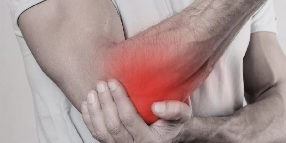 man with pain in elbow pain relief concept