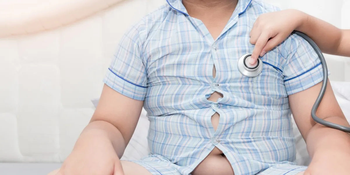 little hand doctor check heart by stethoscope to obese asian boy, healthcare concept