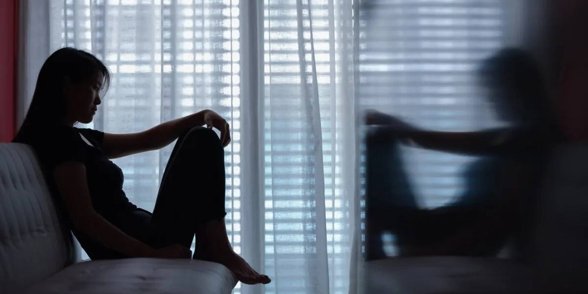 sad woman seating alone