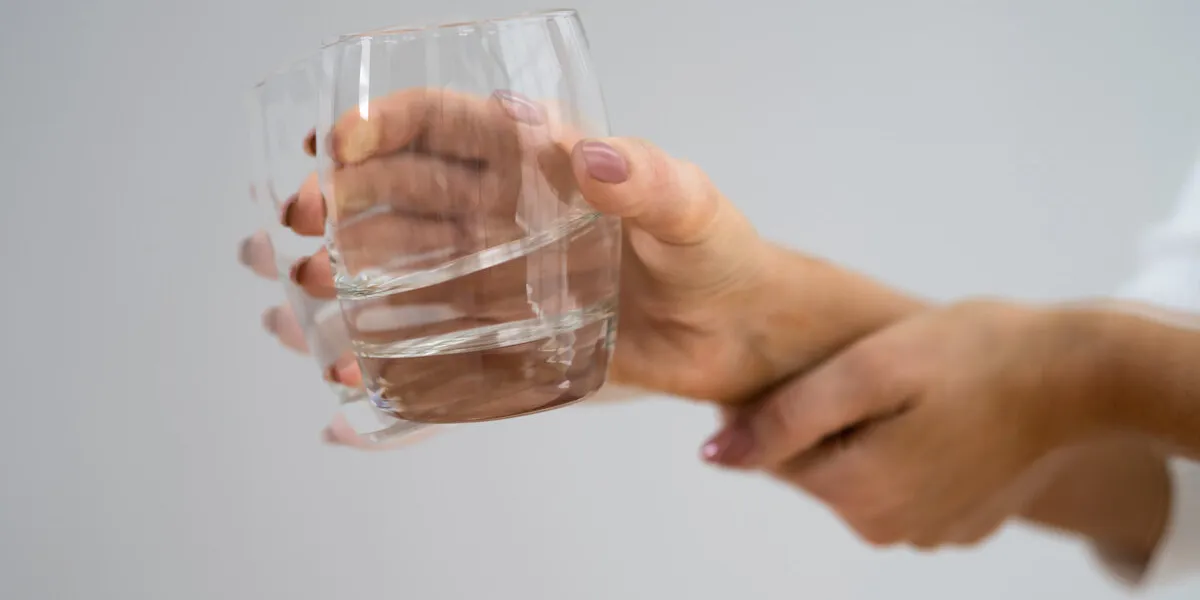 person hand with dystonia degenerative aging movement