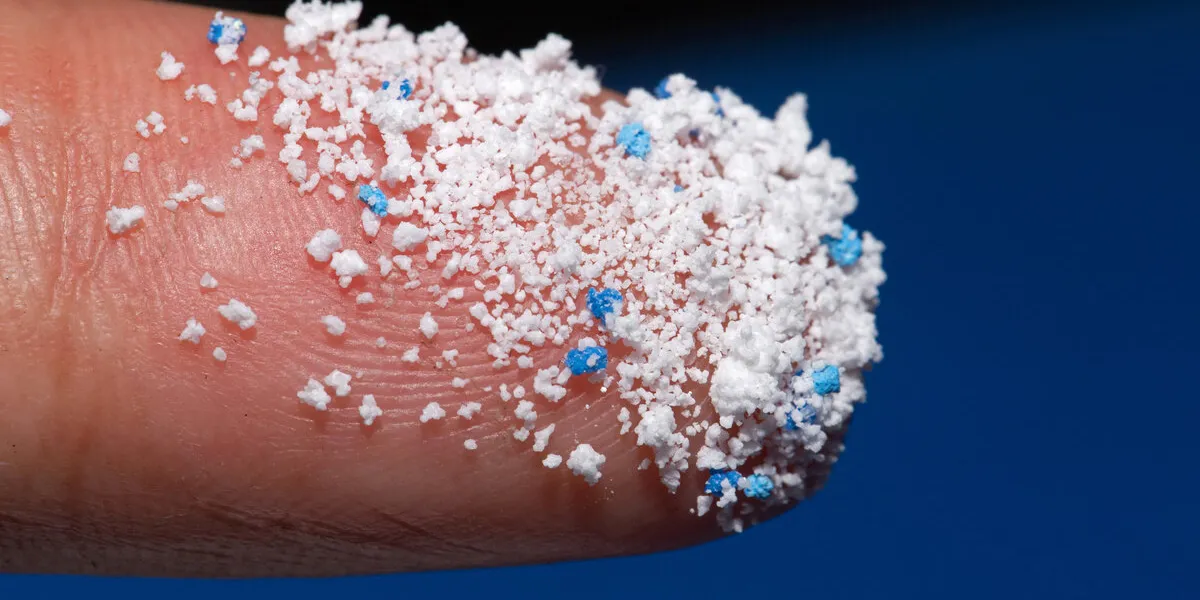 small plastic pellets on the fingermicro plasticair pollution