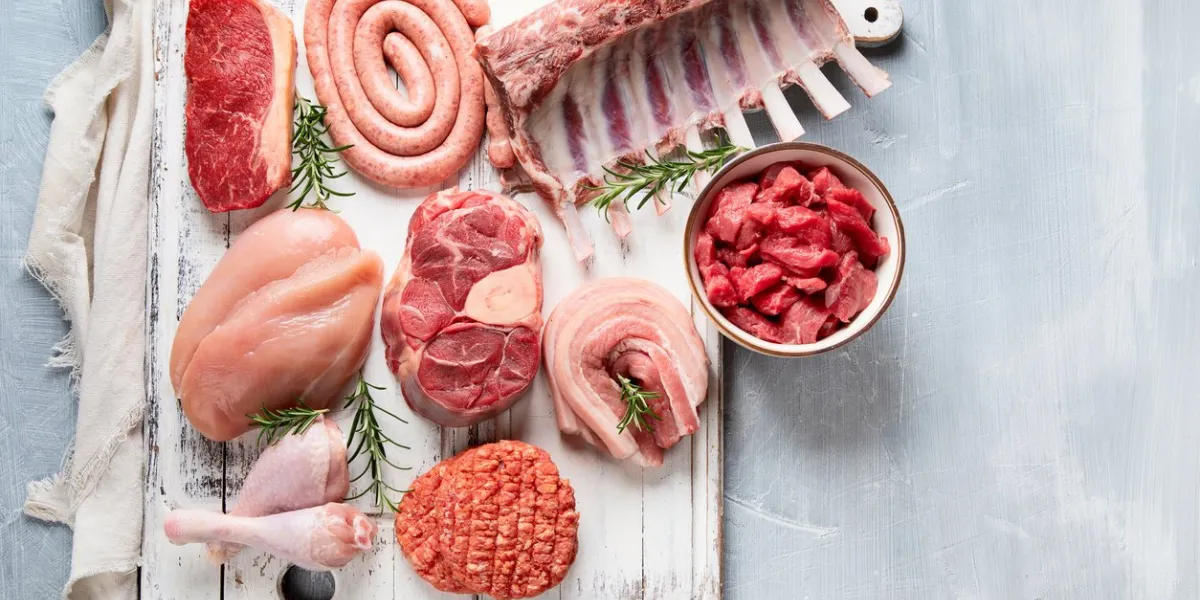 raw meat - beef, pork, lamb, chicken with seasoning top view with copy space