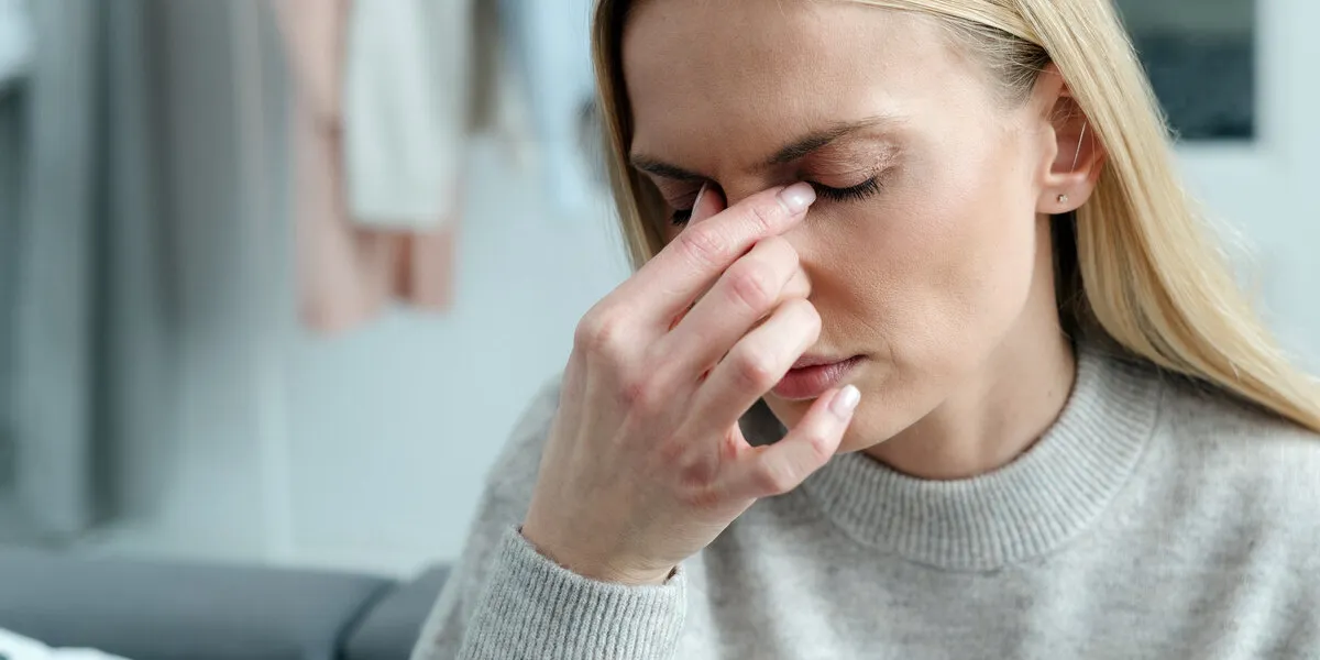 closeup of female with headache suffer from blurry poor vision, girl feeling eyestrain and migraine, stressed person, overwork concept