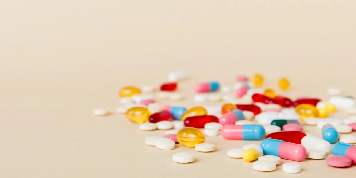 many different colorful medication and pills perspective view set of many pills on colored background