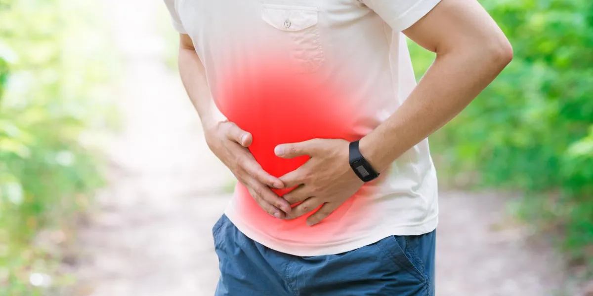 man with abdominal pain, injury while running, trauma during workout, outdoors concept