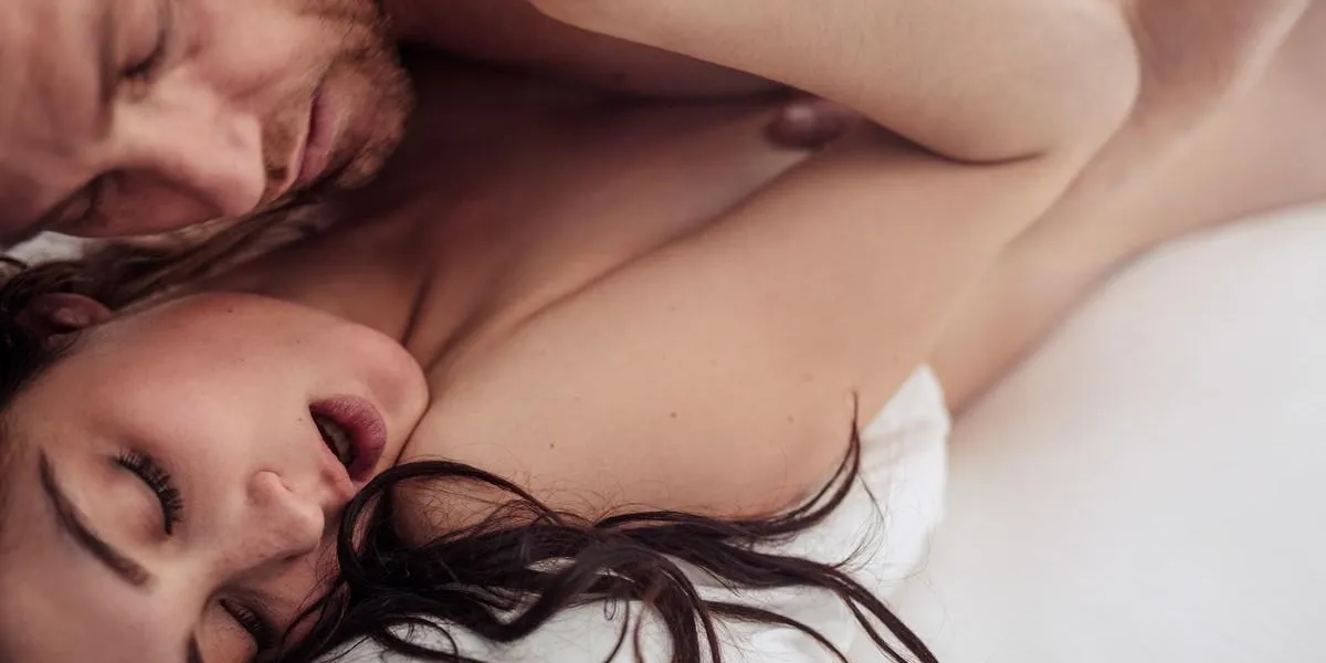 close up shot of sensual young couple having sex on bed