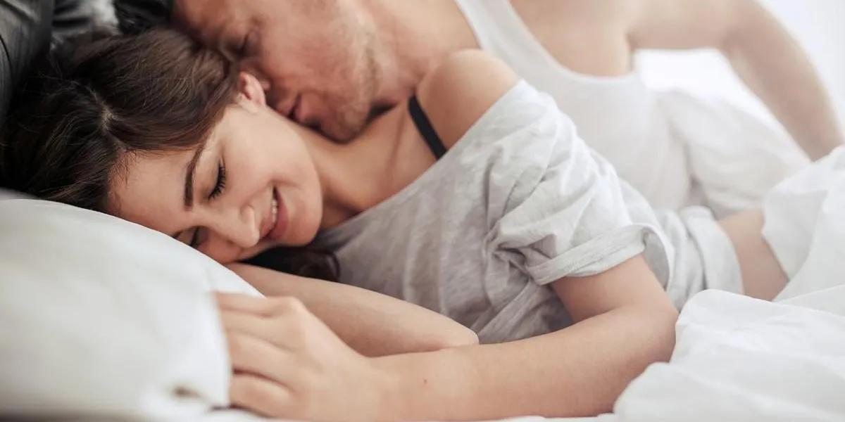 romantic couple in bedroom enjoying sensual foreplay woman smiling and feeling loved
