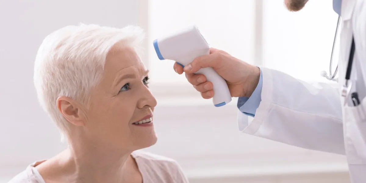 temperature screening fevers measure forehead by infrared for patient in clinic during coronavirus epidemic