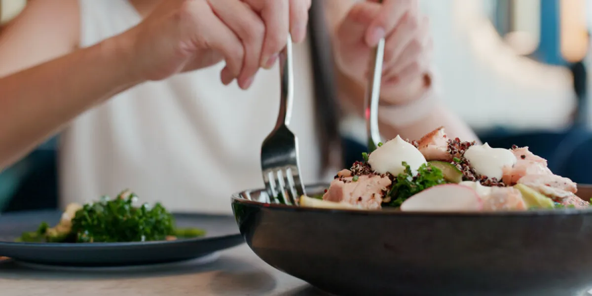 woman enjoy the salad in restaurant