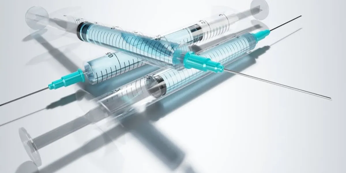 three syringes with vaccine  medication isolated on grey background - 3d illustration