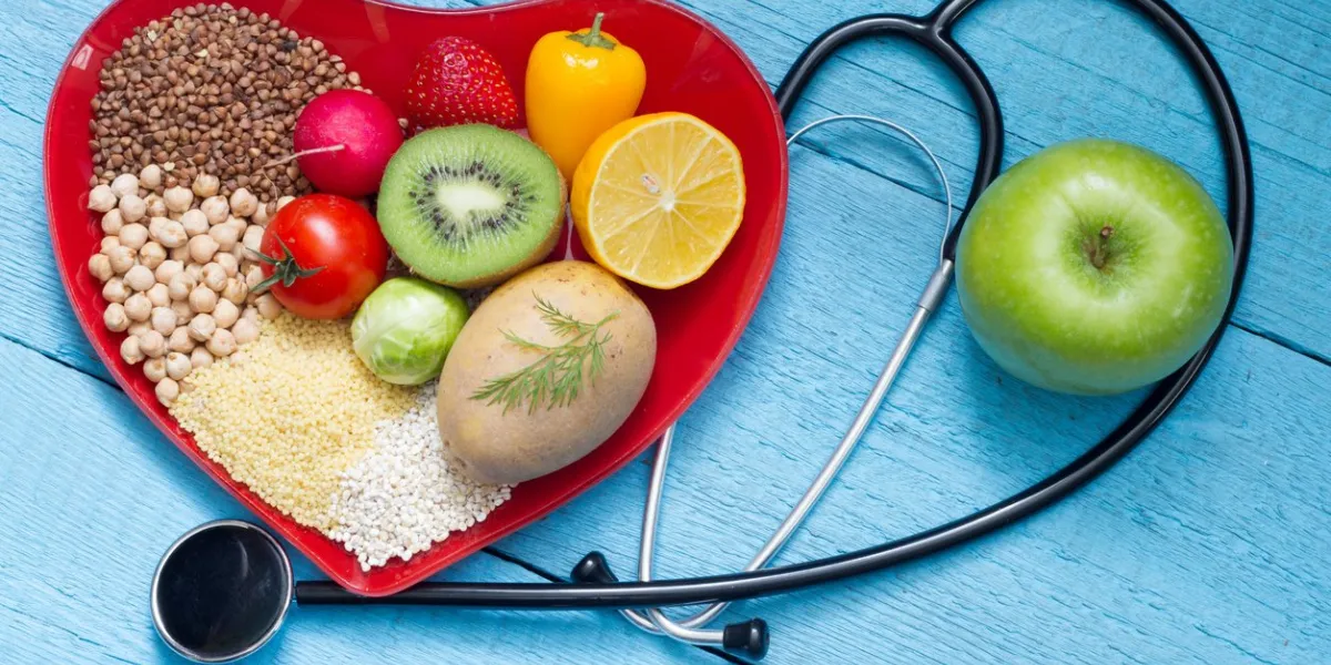 food on heart plate with stethoscope cardiology concept