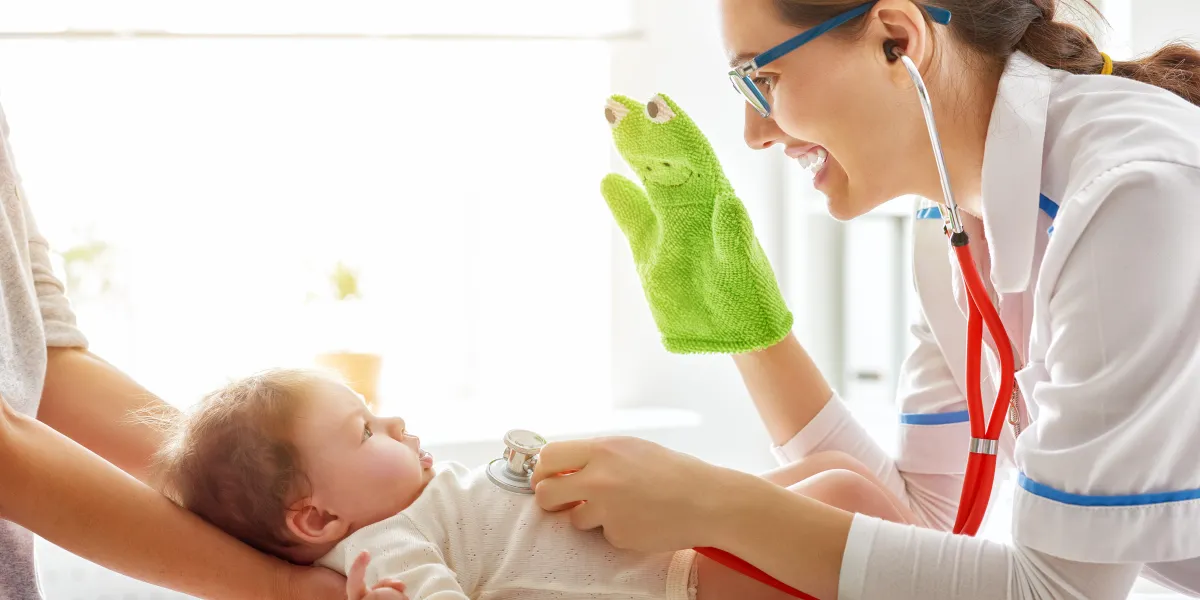 doctor examining a baby in a hospital