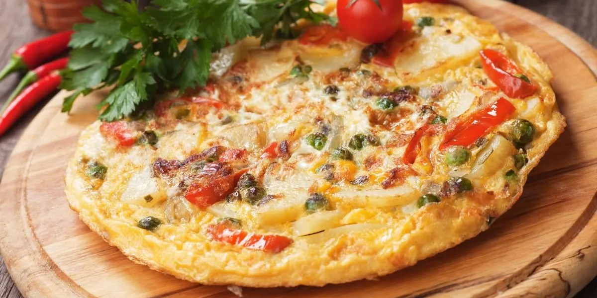 tortilla, spanish omelet with fried potato and vegetables