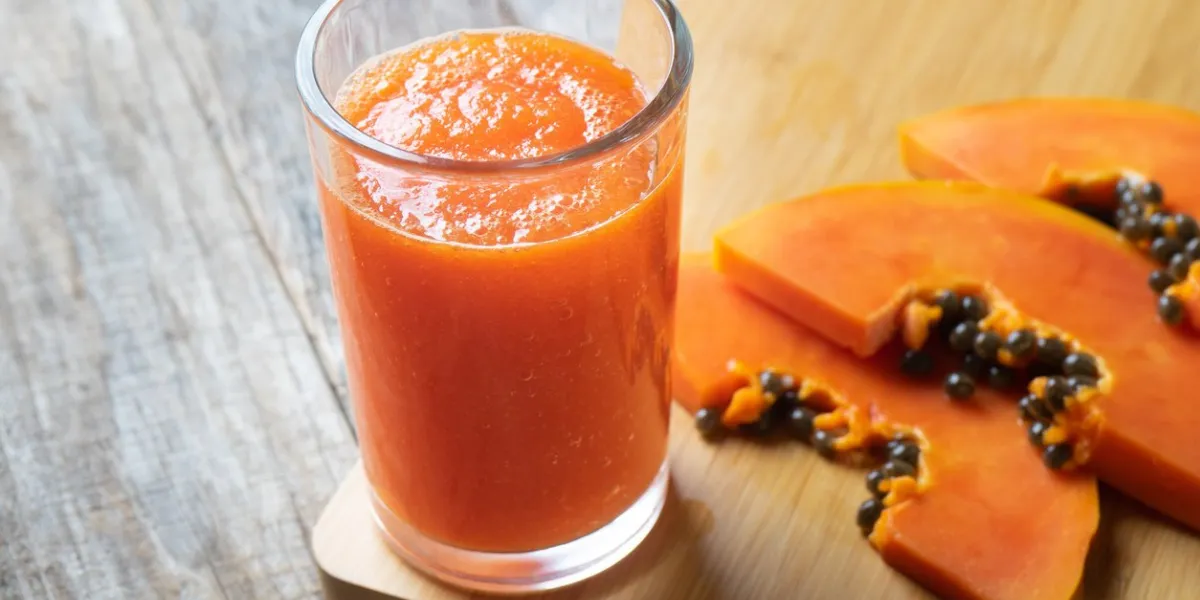 glass of tasty papaya water or juice