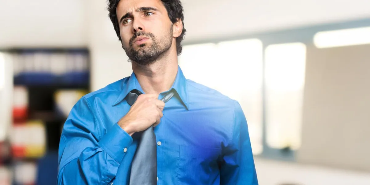 sweating businessman due to hot climate