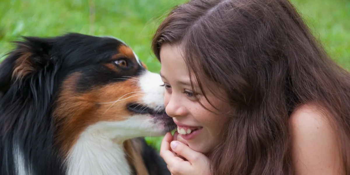 smiling girl with her dog