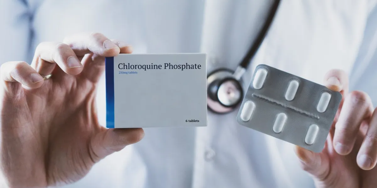 doctor holding chloroquine phosphate drug