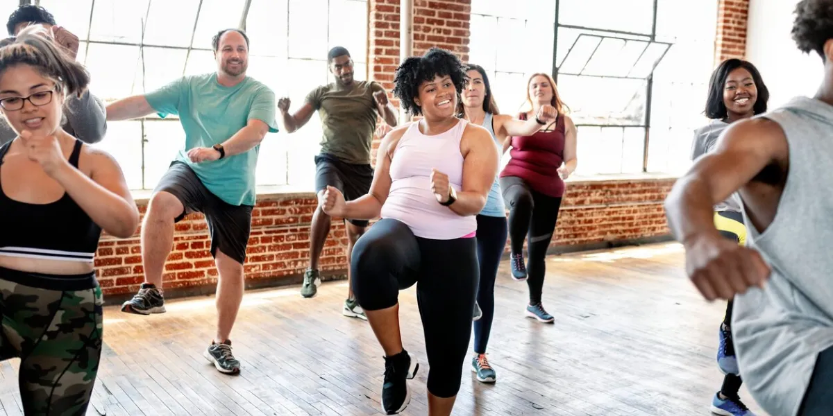 diverse people in an active dance class