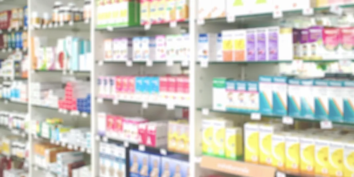 blurred medicines shelves in pharmacy shop , blurred drug store, use as background