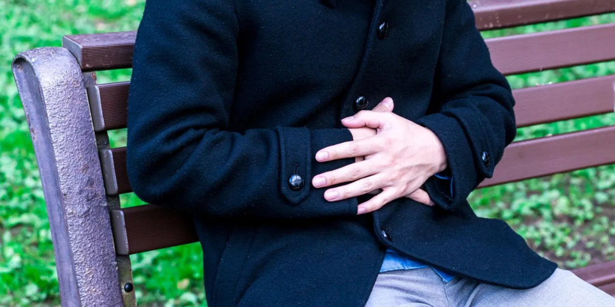 man holding his stomach