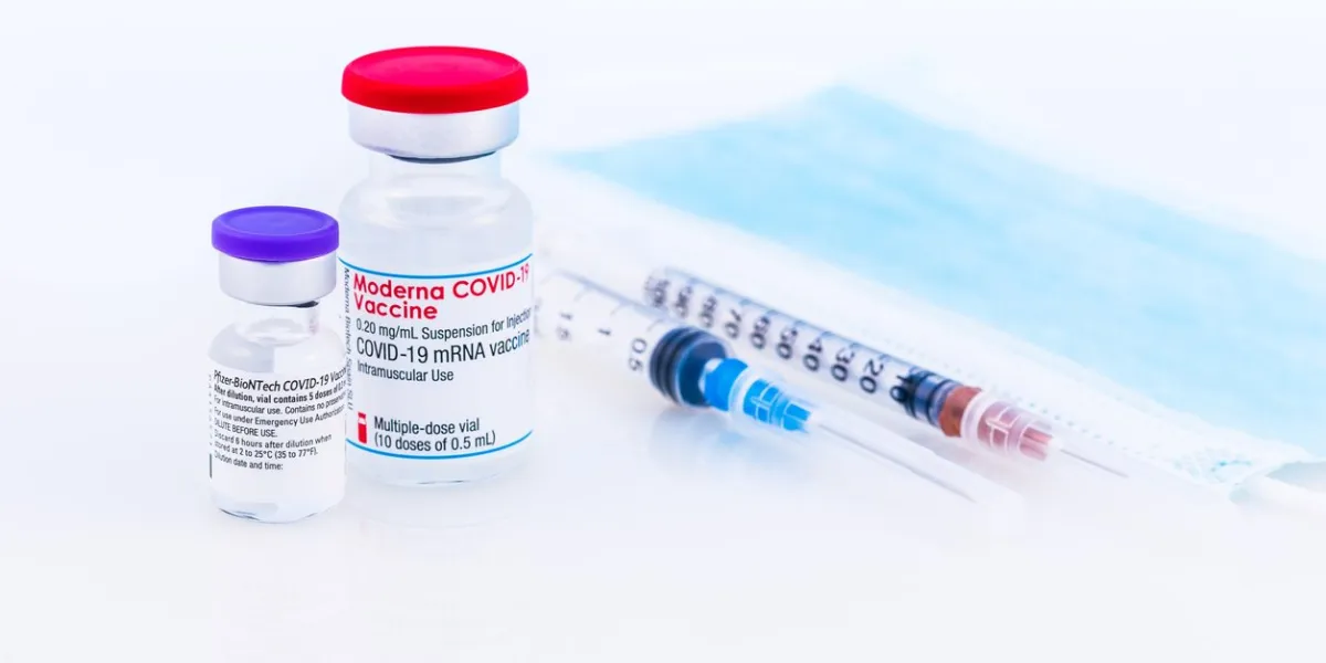 brasov, romania - february 21, 2021  pfizer biontech and moderna covid-19 vaccine on a white background