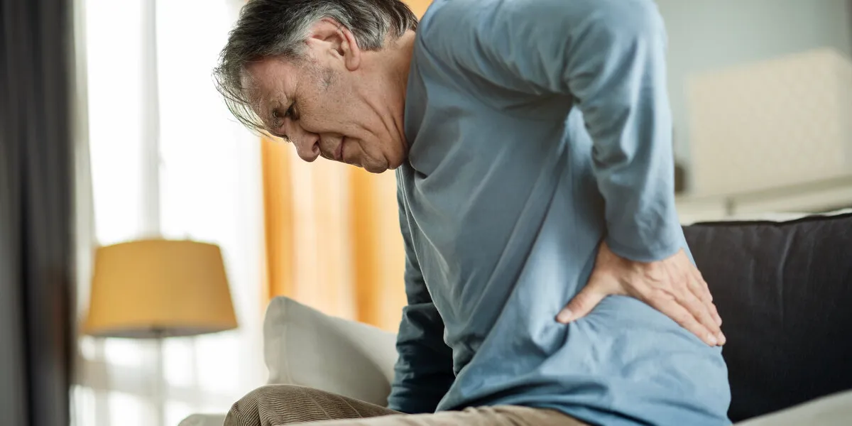 old man suffering from back pain