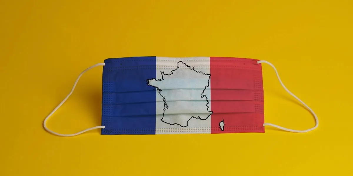 coronavirus protective mask medical mask with france flag and maps combined yellow background face mask protection against pollution, virus, flu healthcare and surgery concept