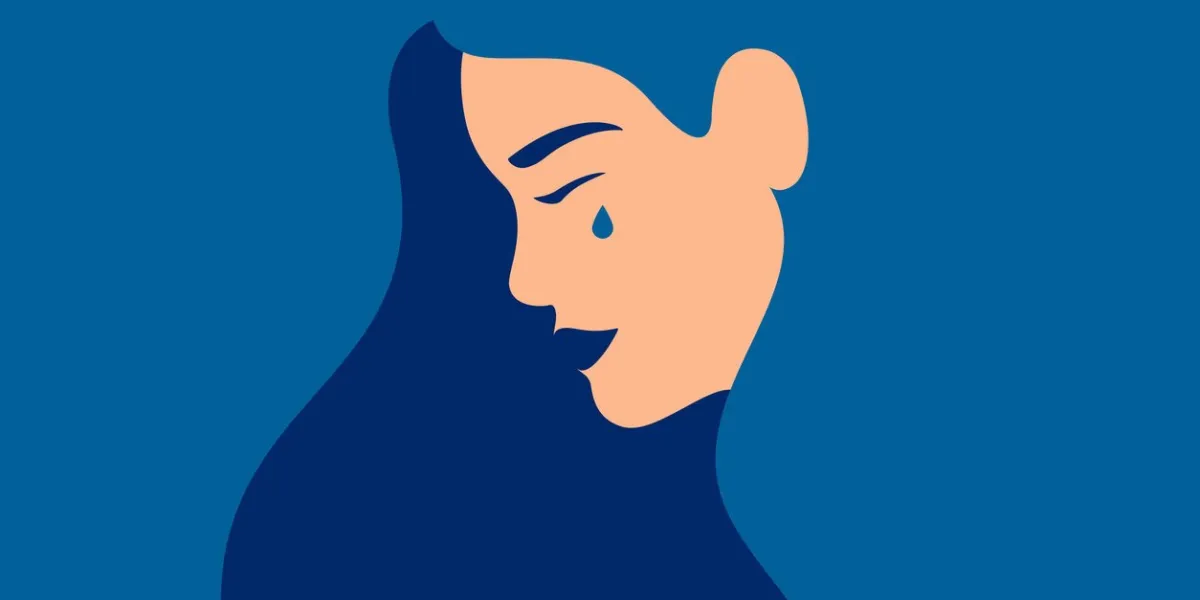 sad young girl is crying on a blue background side view of weeping woman emotions grief human character vector illustration
