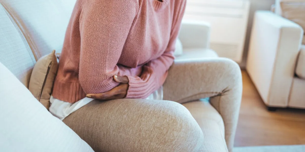 cropped shot of an attractive young woman lying down on her bed and suffering from period pains at home ouch my tummy woman with menstrual pain