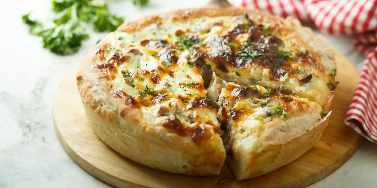 homemade mushroom pie with cheese and parsley