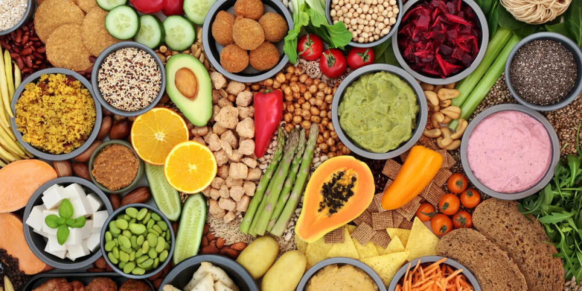 plant based vegan food for good health with vegetables, fruit, tofu meat substitute products, cereals legumes & dips high in protein, antioxidants, vitamins, minerals, fibre & smart carbs ethical eating