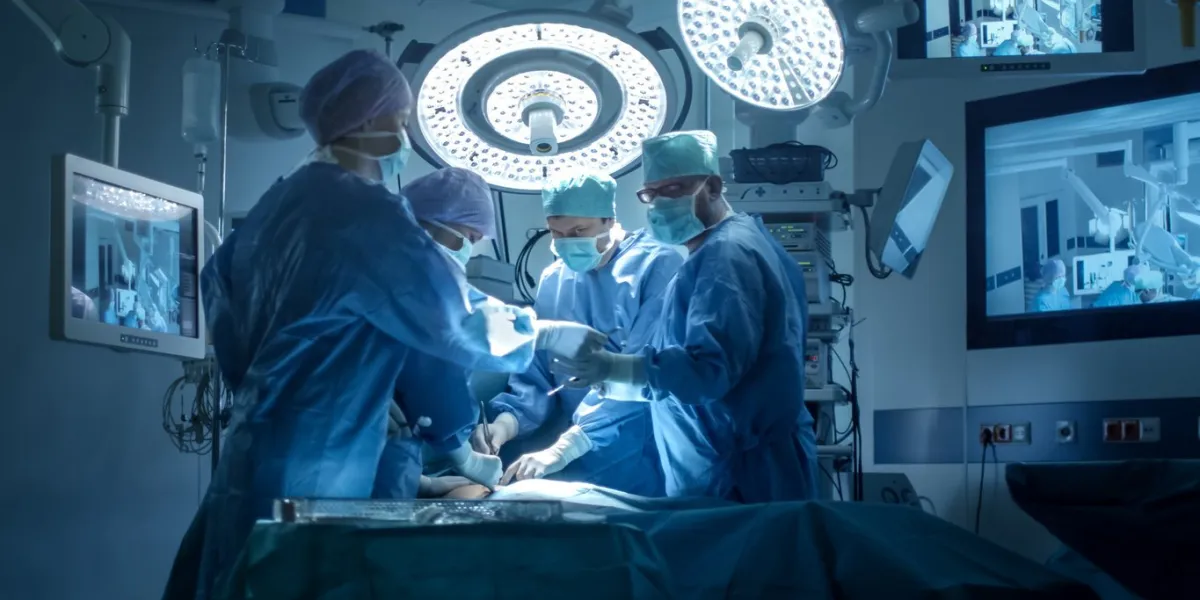 medical team performing surgical operation in modern operating room
