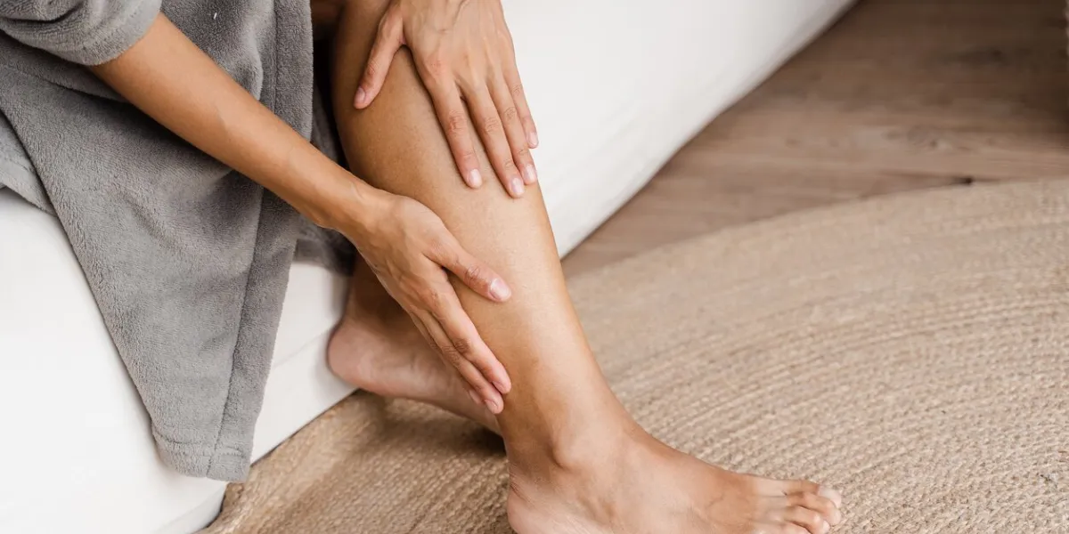 deep vein thrombosis and varicose of african woman girl touching her legs and looking at veins sclerotherapy procedure at visiting vascular surgeon doctor