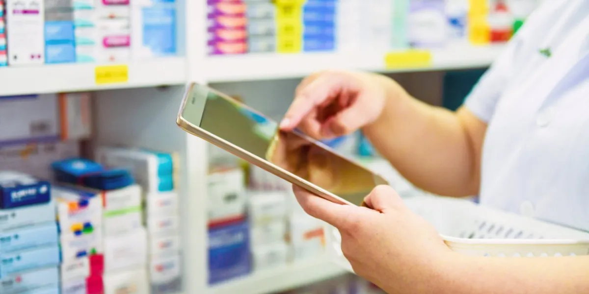 pharmacist filling prescription in pharmacy drugstore