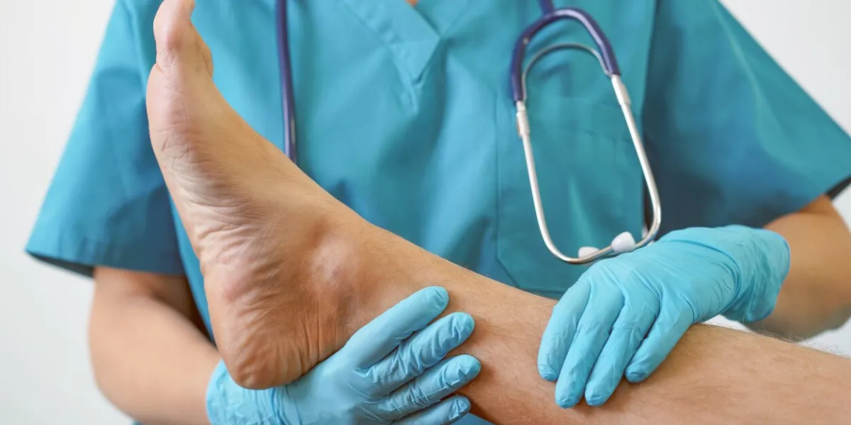 hand of doctor holding patient's leg, examination of patients in the hospital surgeon, surgical doctor, anesthetist holding leg patient's professional er surgical, healthcare concept