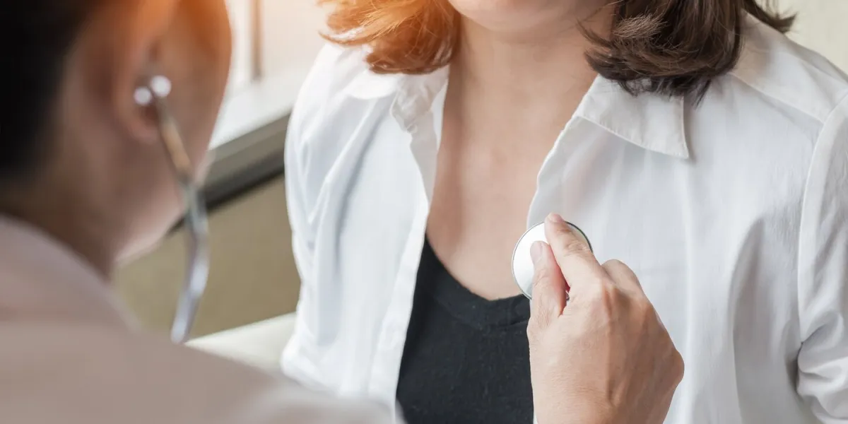 doctor examining patient health on coronary artery disease, blood vessel or congenital heart defect, heart rhythm problem, arrhythmias, cardiovascular illness in medical clinic by checking heartbeat