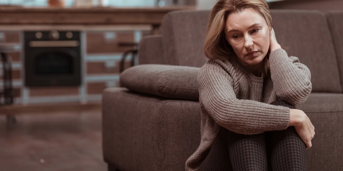 feeling depressed woman wearing brown squared trousers feeling depressed after work problems