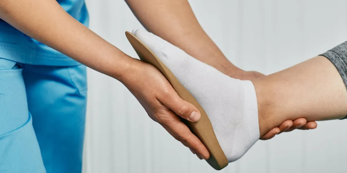 orthopedic insoles orthopedist fitting individual orthopedic insole for patient foot