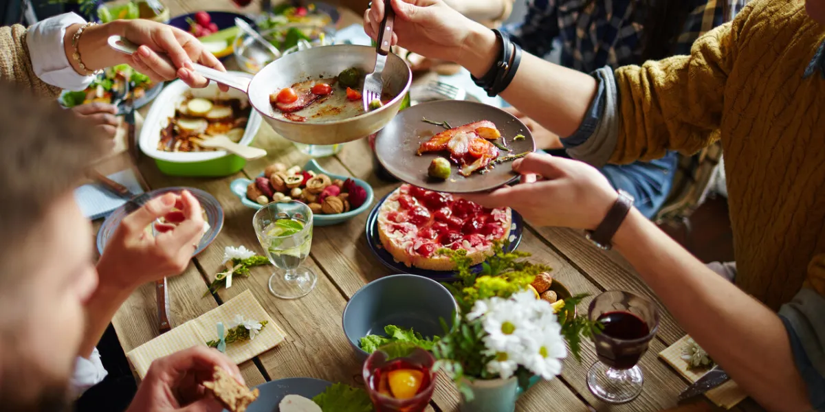 people sitting at dining table and eating